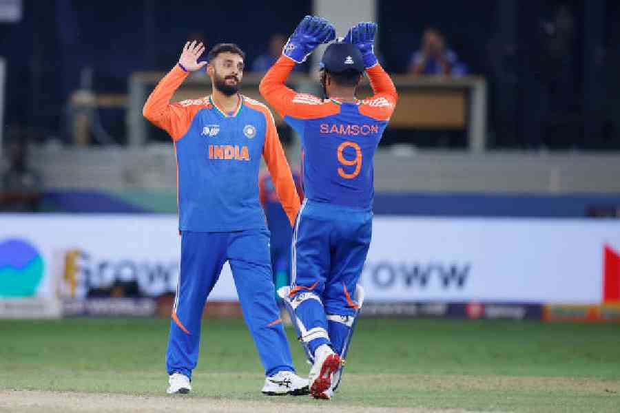 Varun Chakravarthy and Sanju Samson during theSuper Four match against Sri Lanka in Dubai on Friday. Picture courtesy BCCI 