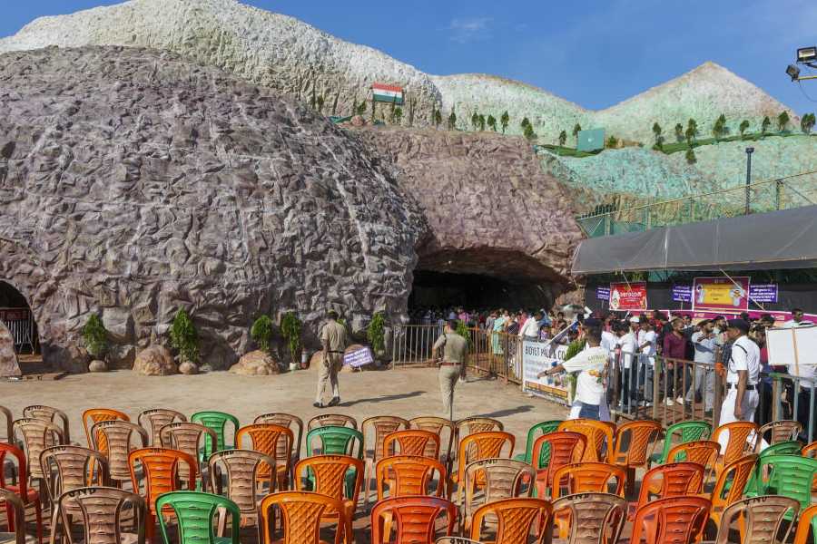 Security personnel keep vigil as people visit the Santosh Mitra square pandal themed on Operation Sindoor during the 'Durga Puja' festival, in Kolkata, West Bengal, Sunday, Sept. 28, 2025.