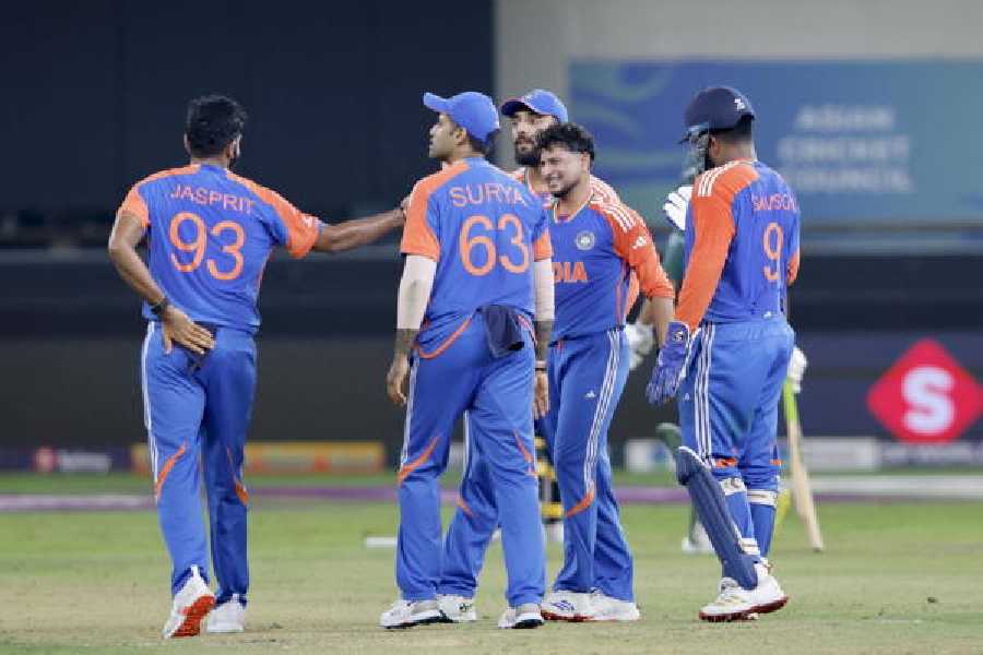 Kuldeep Yadav celebrates with his teammates after a wicket, against Pakistan on Sunday.