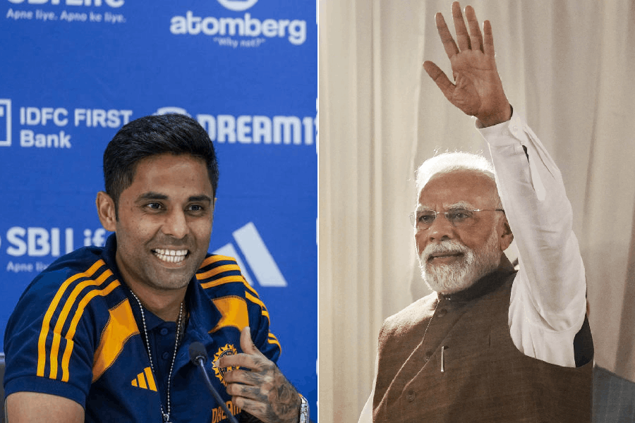 Suryakumar Yadav (left), PM Narendra Modi (right)
