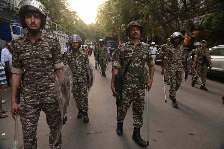 Central force personnel in front of the office of Bengal’s chief electoral officer on Strand Bank Road on Tuesday. Picture by Bishwarup Dutta
