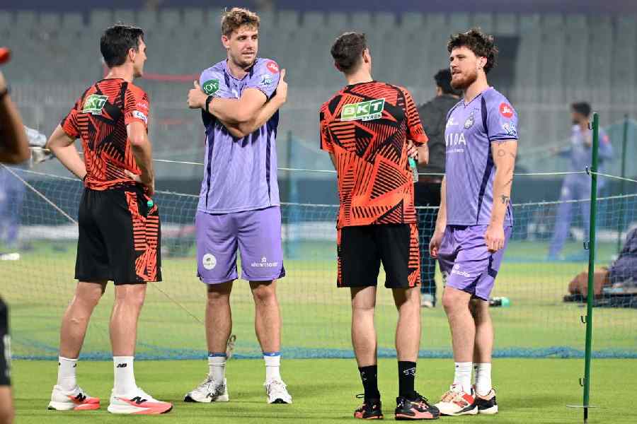KKR’s Cameron Green (left) and Finn Allen (right) chat with a member of Sunrisers Hyderabad at Eden Gardens on Tuesday.