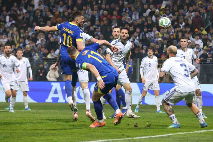 Bosnia and Herzegovina's Ermedin Demirovic heads at goal.