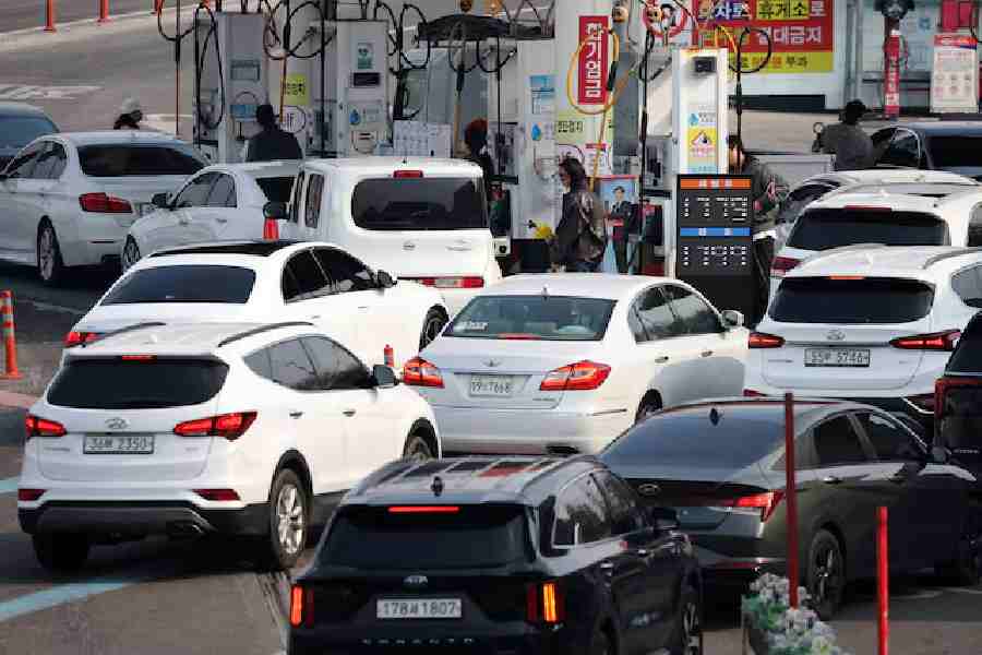 Cars line up at a gas station in Seoul, South Korea, March 9, 2026.