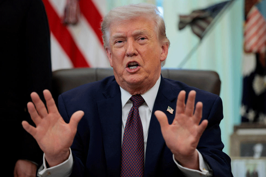 US President Donald Trump speaks during the signing ceremony for an executive order on mail ballots, in the Oval Office of the White House in Washington, D.C., March 31, 2026.