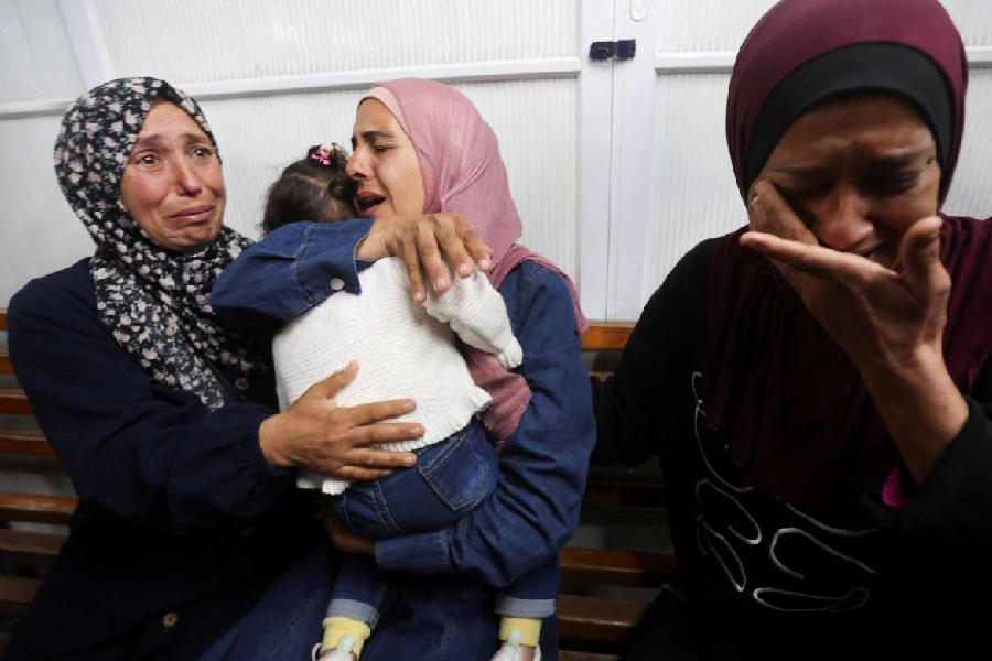 Family members reunite with a child who was evacuated from Gaza as a premature baby during the two-year Israeli offensive, and has returned after receiving medical treatment in Egypt, at Nasser Hospital in Khan Younis in the southern Gaza Strip, March 30, 2026.