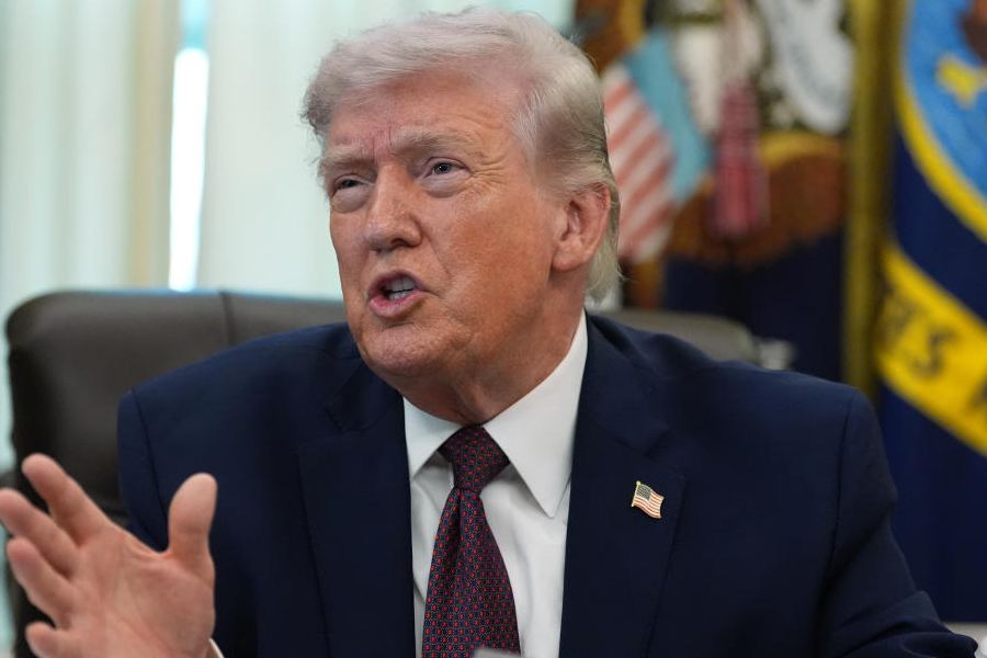 President Donald Trump answers questions from reporters after signing an executive order in the Oval Office of the White House Tuesday, March 31, 2026, in Washington.