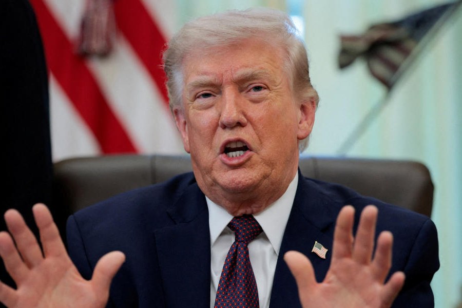 US President Donald Trump speaks during the signing ceremony for an executive order on mail ballots, in the Oval Office of the White House in Washington, DC, March 31, 2026.