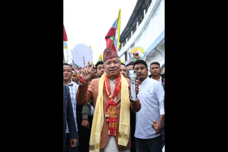 BGPM’s Kurseong candidate Amar Lama, with his election symbol, a torch, on Wednesday.