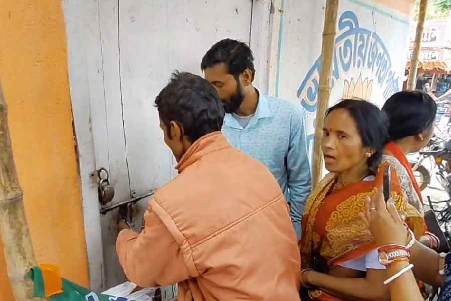 BJP supporters lock up the party office in Mainaguri on Wednesday.