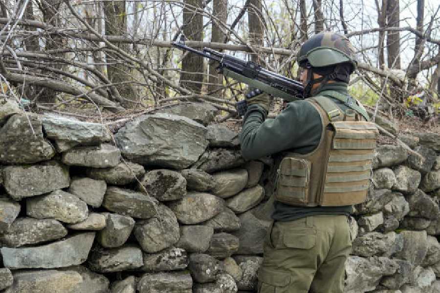 A jawan stands guard during a search operation in Ganderbal, Jammu and Kashmir, on Wednesday. (PTI)