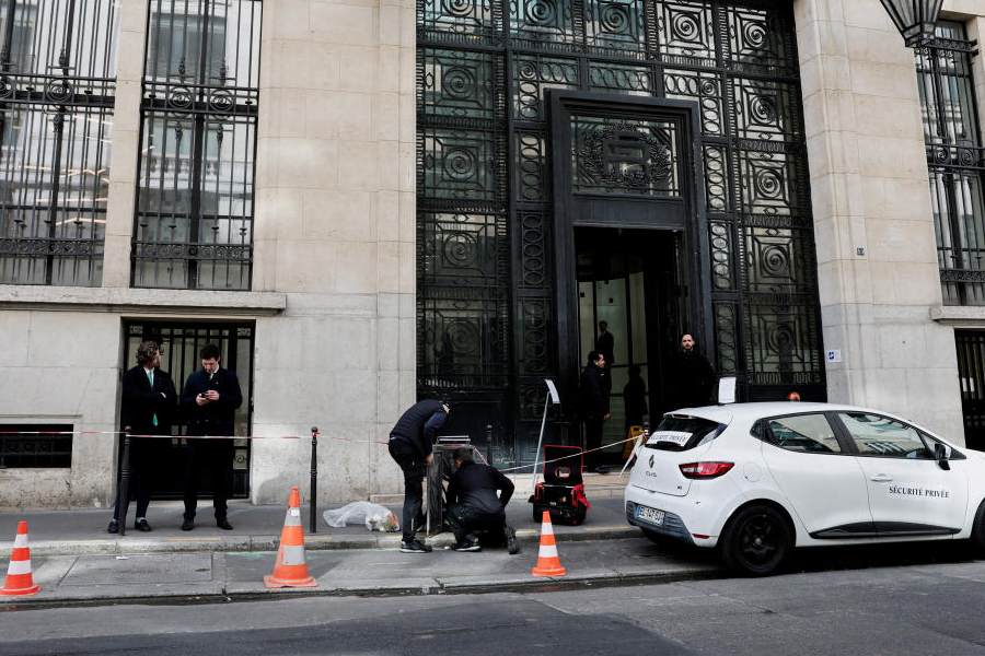 Private security members gather outside Bank of America’s Paris offices, after French anti-terrorism prosecutors opened an investigation into attempted destruction by fire or other dangerous means in Paris, France, March 30, 2026.