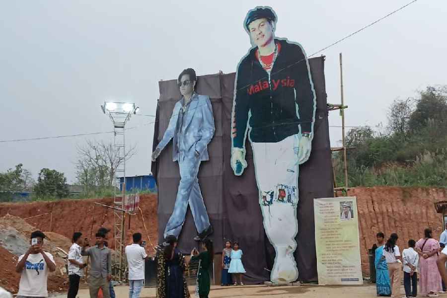 Fans pose with giant cutouts of Zubeen Garg at Zubeen Kshetra in Sonapur near Guwahati. 