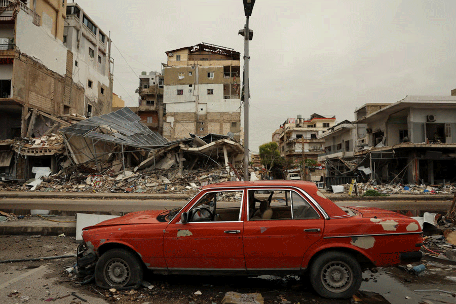A car damaged car in front of the rubble of a building destroyed by an Israeli strike, amid escalating hostilities between Israel and Hezbollah, as the U.S.-Israeli conflict with Iran continues, in Tyre, Lebanon, April 2, 2026.