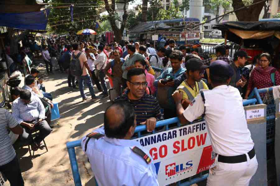 TET candidates wait outside the office of the West Bengal Board of Primary Education for paper verification last November 