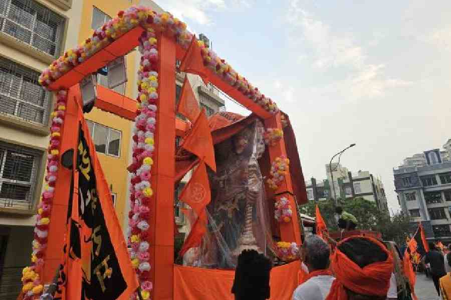 A Hanuman idol wrapped in plastic sheets after it started raining at the inception of a Ram Navami rally in Action Area 1. (Sudeshna Banerjee)