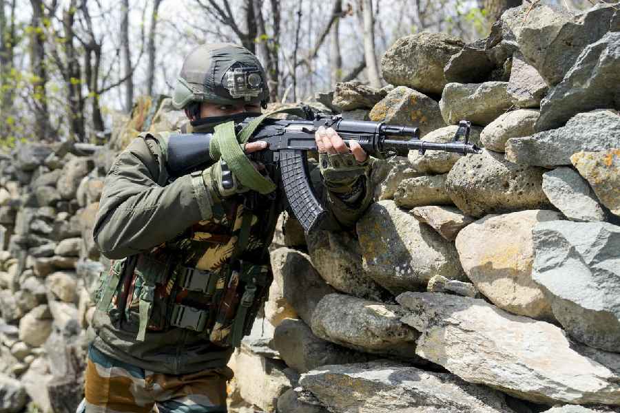 A jawan stands guard during a search operation in Ganderbal on Wednesday.