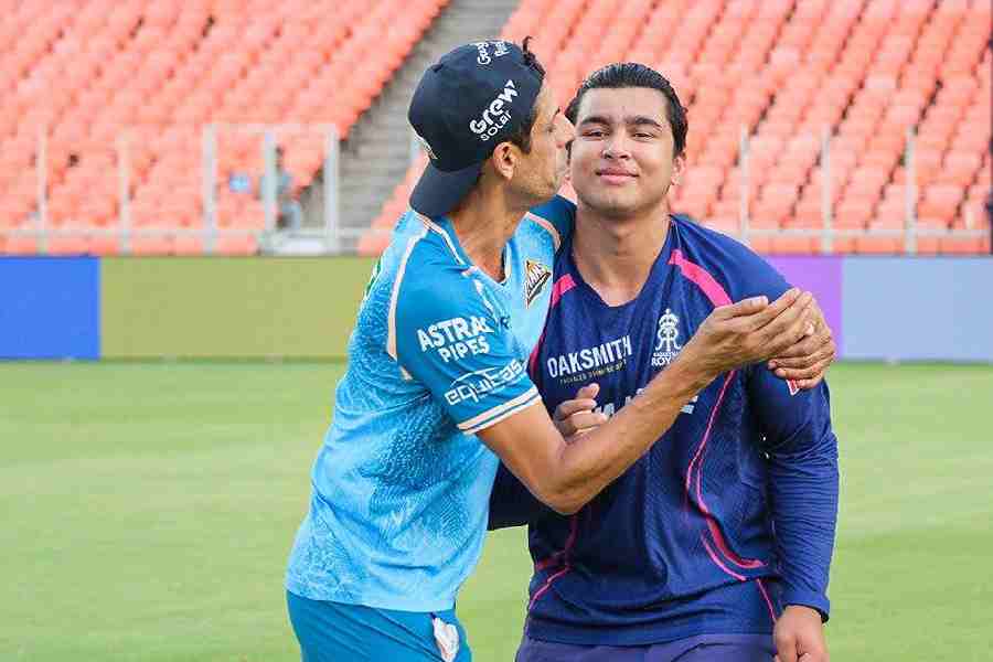 Gujarat Titans head coach gives Rajasthan Royals’ Vaibhav Sooryavanshi a hug before they settle in opposite dugouts on Saturday.