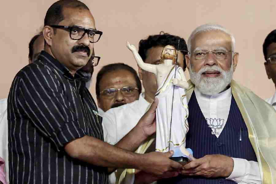 Narendra Modi being felicitated at a rally in Tiruvalla, Kerala, on Saturday. 