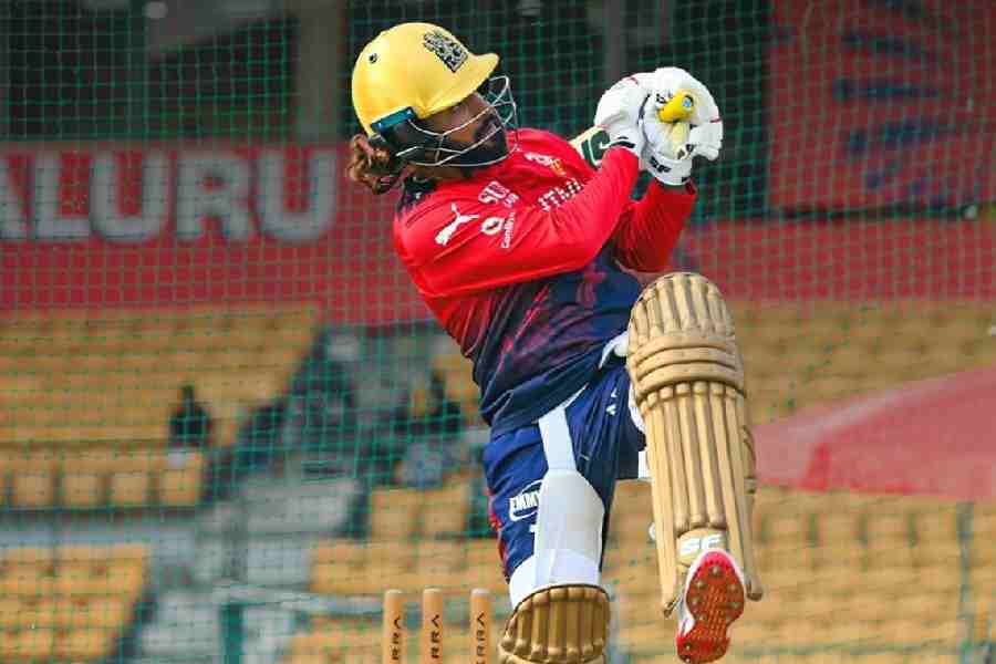 RCB skipper Rajat Patidar strikes a pose at training.