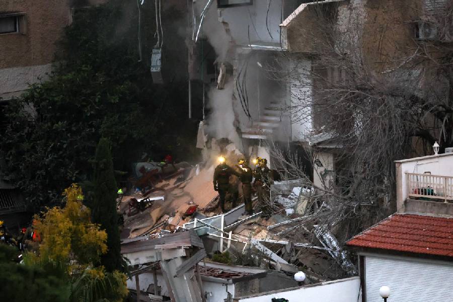 First responders work at the site of a projectile impact, as the U.S.-Israel conflict with Iran continues, in northern Israel, April 5, 2026.