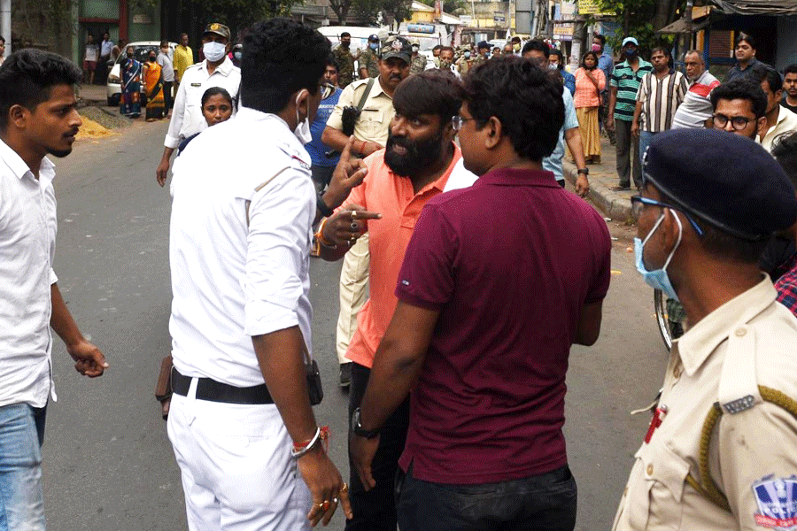 BJP supporters argue with the police