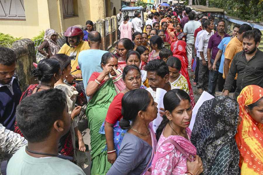 People queue up to submit their petitions before the Special Tribunal after their names were deleted from the Special Intensive Revision final voter list, at Ranaghat town, in Nadia, Monday, April 6, 2026.