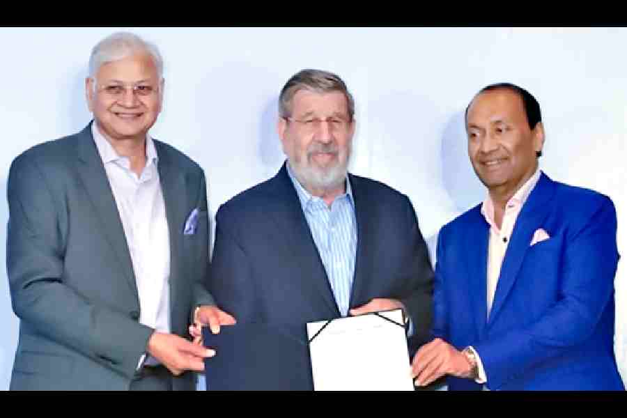 (From left) Sushil Mohta, William Ellwood Heinecke and Sanjay Saraf in Calcutta on Monday.