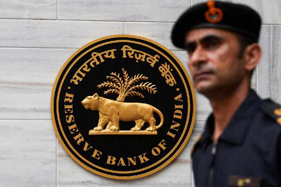 A man walks past the Reserve Bank of India (RBI) logo outside its headquarters in Mumbai, India, June 6, 2025.