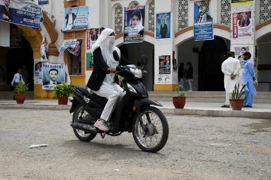 Mehwish Qureshi, 33, an advocate, rides a motobike in Hyderabad, Pakistan April 2, 2026.