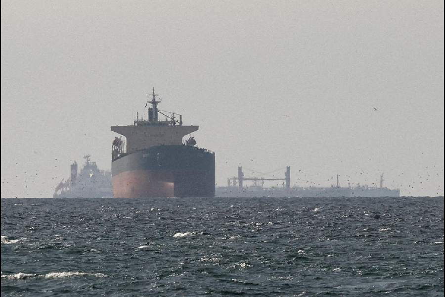 Cargo ships in the Gulf, near the Strait of Hormuz, as seen from northern Ras al-Khaimah, near the border with Oman’s Musandam governance, amid the U.S.-Israeli conflict with Iran, in United Arab Emirates, March 11, 2026.