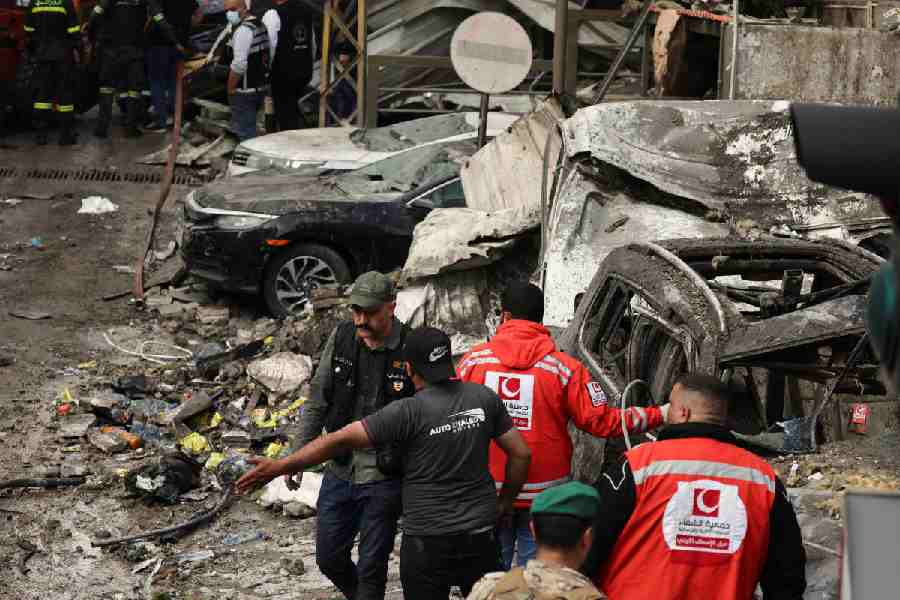 Emergency responders work at the site of an Israeli strike, in Al-Mazraa in Beirut, Lebanon, April 8, 2026.