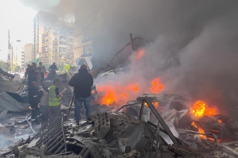 Rescuers gather at the site of an Israeli airstrike in Beirut, Lebanon, Wednesday, April 8, 2026.