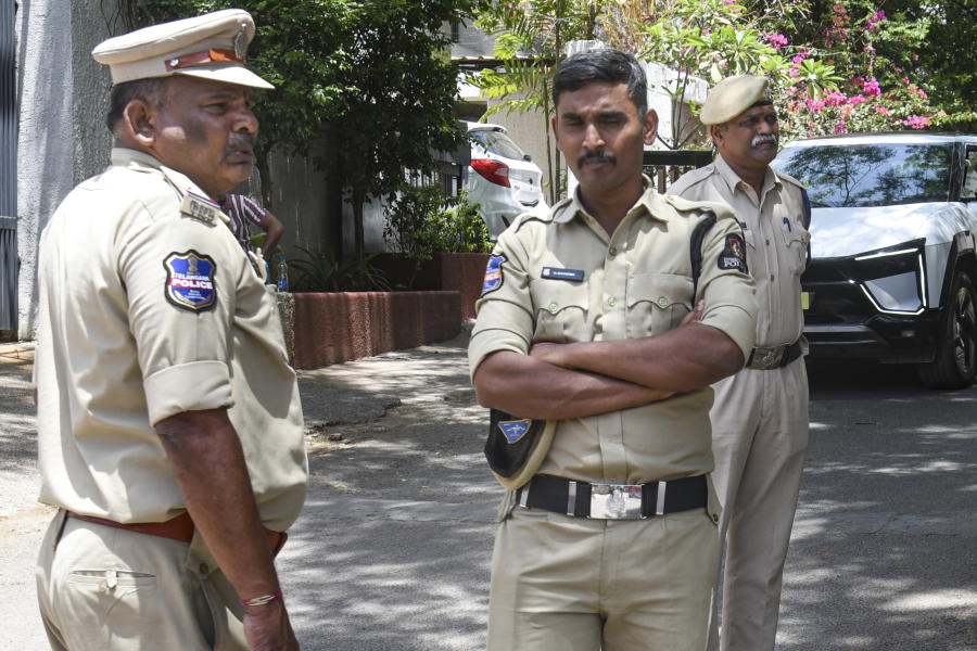 Police personnel stand guard outside the residence of Congress leader Pawan Khera, at Banjara Hills, in Hyderabad, Telangana, Wednesday, April 8, 2026.