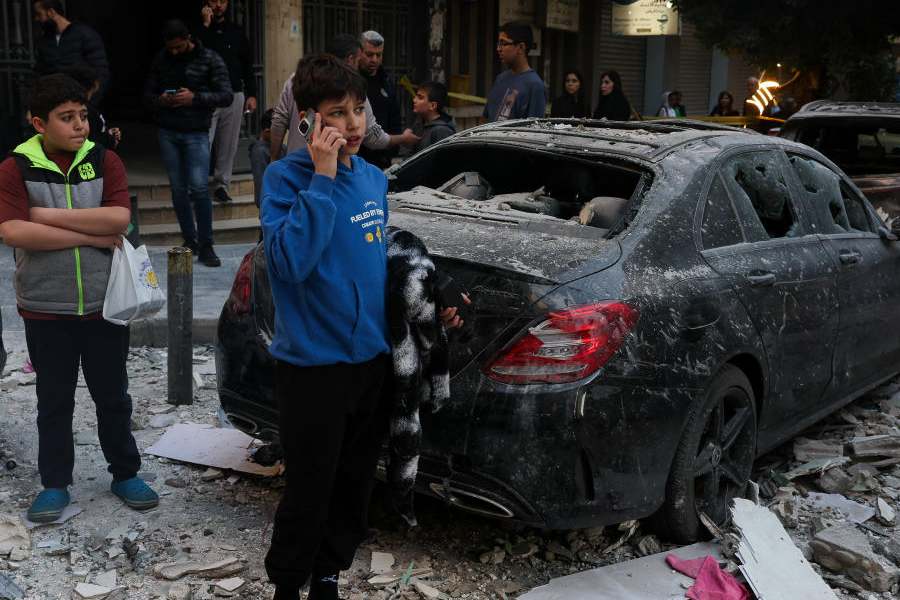 People stand at a site of an Israeli strike in Mar Elias, Beirut, Lebanon, April 8, 2026.