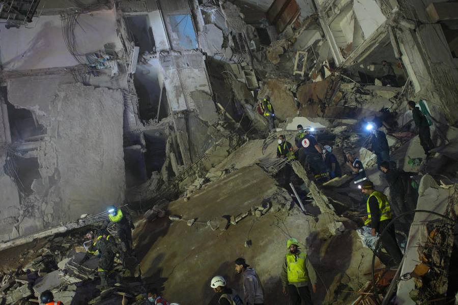Rescuers search for victims in a destroyed building that was hit in an Israeli airstrike in central Beirut, Lebanon, Wednesday, April 8, 2026.