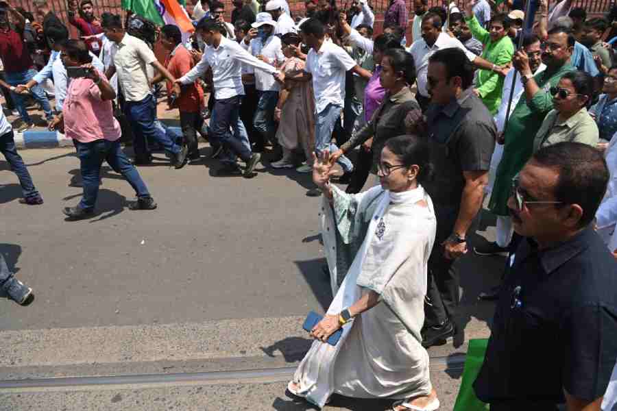 Mamata Banerjee, along with her supporters, goes to the Alipore Survey Building in Calcutta to file her nomination on Wednesday.