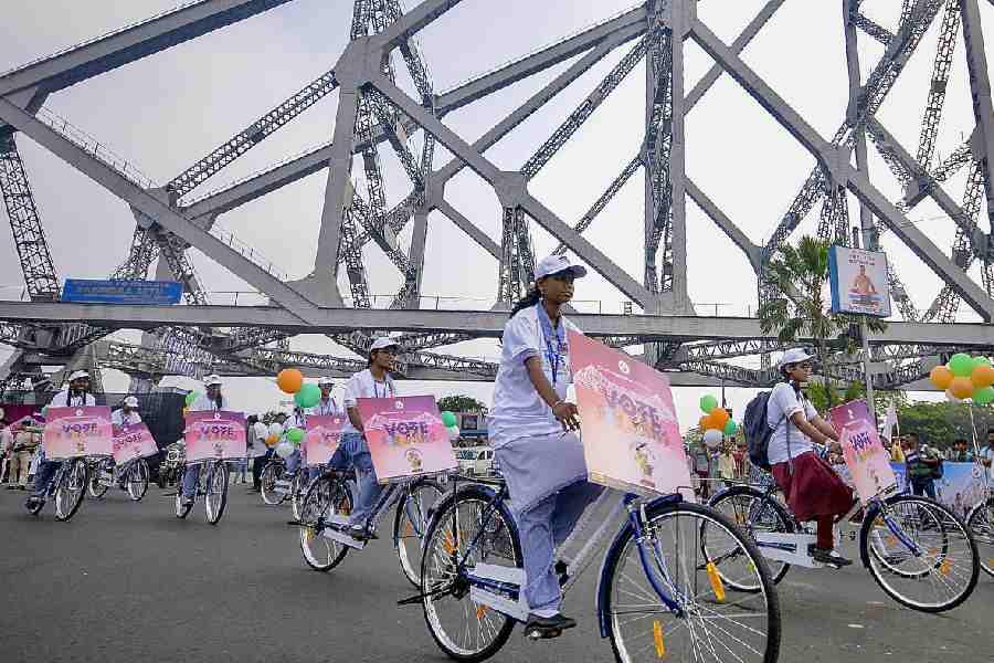 Students take part in a cycle rally on Howrah Bridge as part of an awareness campaign for voters by the Election Commission ahead of the Bengal Assembly polls.