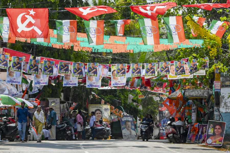 A road is decked up with different political flags and banners as voting is underway during the Kerala Assembly elections, at a polling station, in Thiruvananthapuram, Thursday, April 9, 2026.