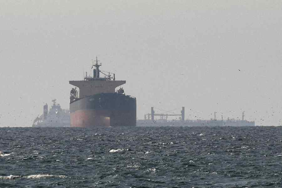 Cargo ships in the Gulf, near the Strait of Hormuz, as seen from northern Ras al-Khaimah, near the border with Oman’s Musandam governance, amid the US-Israeli conflict with Iran, in United Arab Emirates, March 11, 2026.