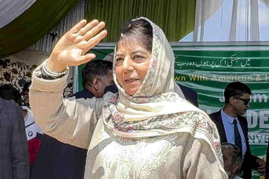 Mehbooba Mufti waves to party workers at a rally in Kulgam on Thursday. 