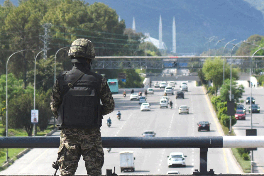 A security guard stands at Zero Point Bridge in a high security area as Pakistan gears up to host the U.S. and Iran for peace talks, in Islamabad, in Islamabad, Pakistan, April 9, 2026.
