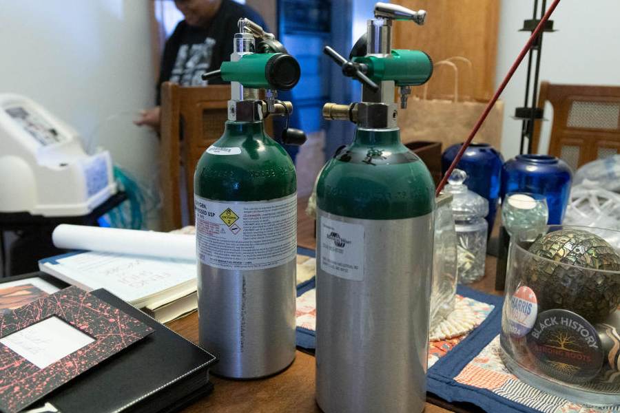 Portable oxygen tanks sit on a dining room table inside the home of Barbara Johnson in Florissant, Missouri, US, February 18, 2026.