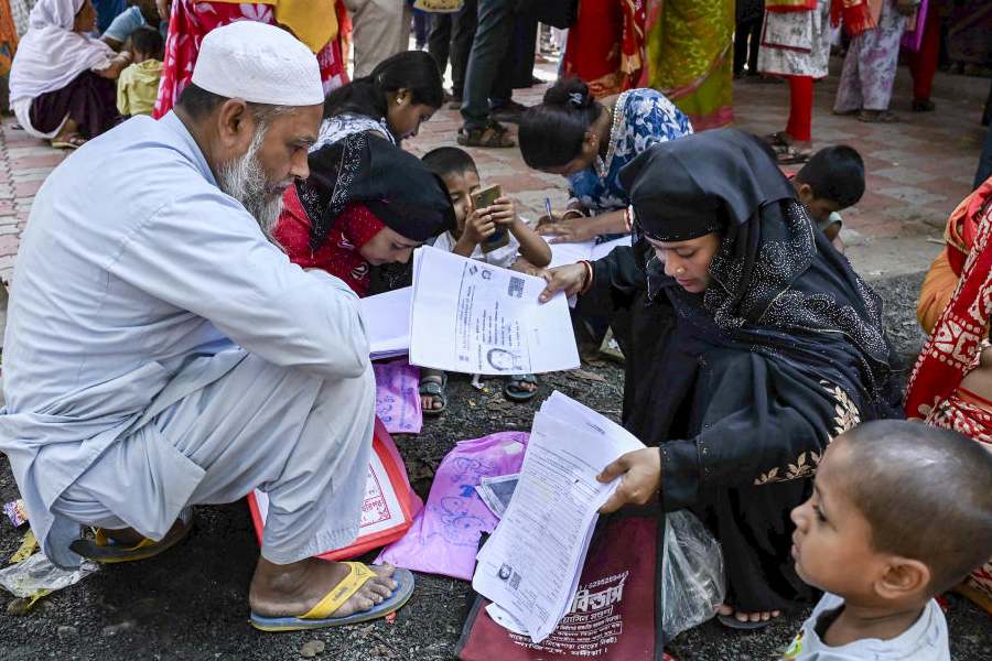 People wait to submit petitions before the Special Tribunal after their names were deleted from the Special Intensive Revision final voter list ahead of the West Bengal Assembly elections, in Nadia, West Bengal, Thursday, April 9, 2026.