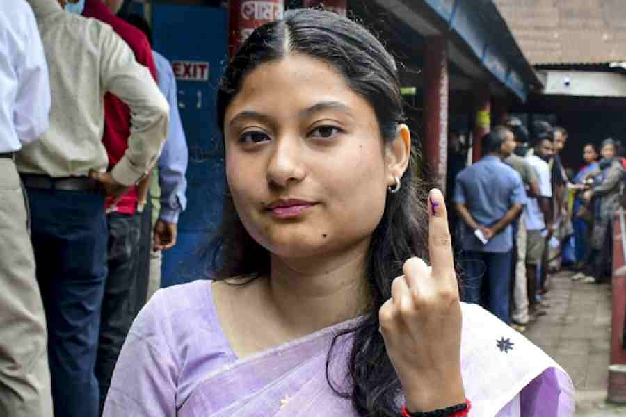 Kunki Chowdhury shows the inked finger after casting her vote on Thursday.