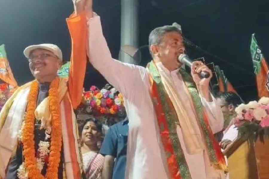 Suvendu Adhikari speaks at the road show in support of Dinesh Sarkar, the BJP candidate from the Rajganj Assembly constituency, in Jalapiguri’s Belakoba on Friday. Picture by Biplab Basak  