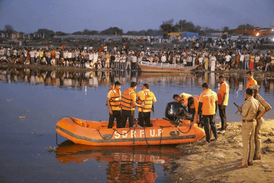 Rescue personnel during a search operation in the Yamuna River after a boat carrying pilgrims capsized near Kesi Ghat, in Mathura district, Friday, April 10, 2026. At least six people were allegedly killed and several others remain missing.