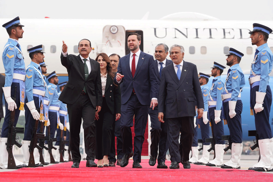 U.S. Vice President JD Vance, center, walks with Pakistan's Chief of Defence Forces and Chief of Army Staff Field Marshall Asim Munir, left, and Pakistani Deputy Prime Minister and Foreign Minister Mohammad Ishaq Dar after arriving for talks with Iranian officials in Islamabad, Pakistan, Saturday, April 11, 2026.
