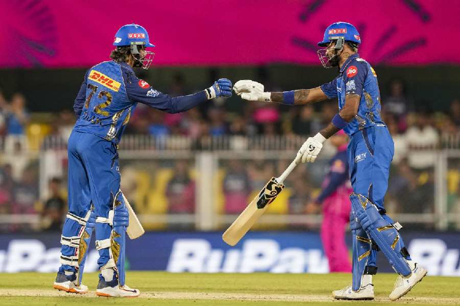 Mumbai Indians' captain Hardik Pandya, right, and Tilak Varma during an Indian Premier League (IPL) 2026 T20 cricket match between Rajasthan Royals and Mumbai Indians, in Guwahati, Tuesday, April 7, 2026.