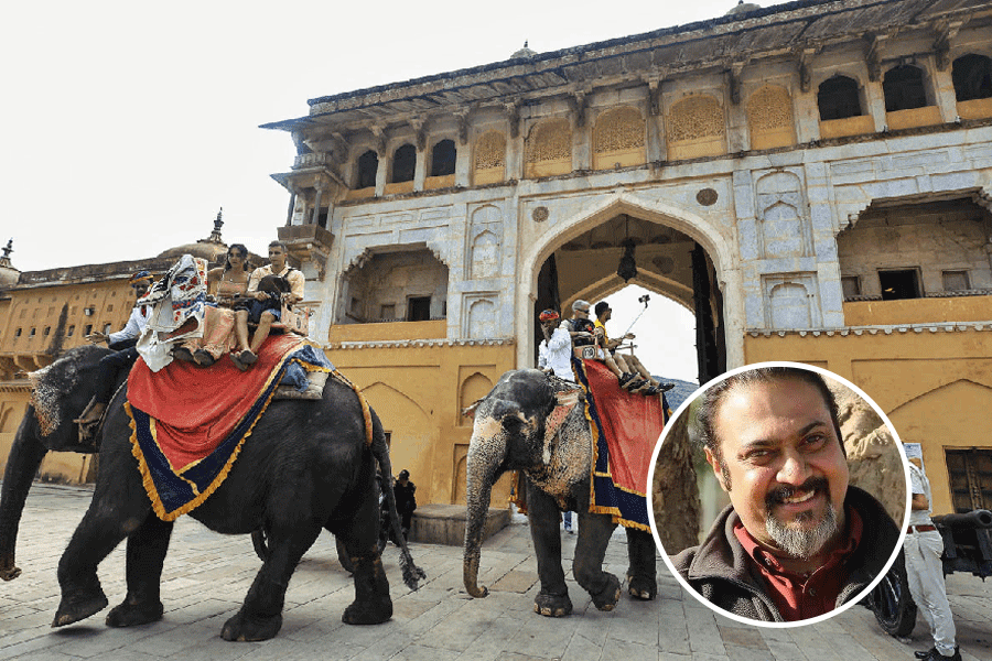 Tourists embark on elephant rides in front of Amer fort.